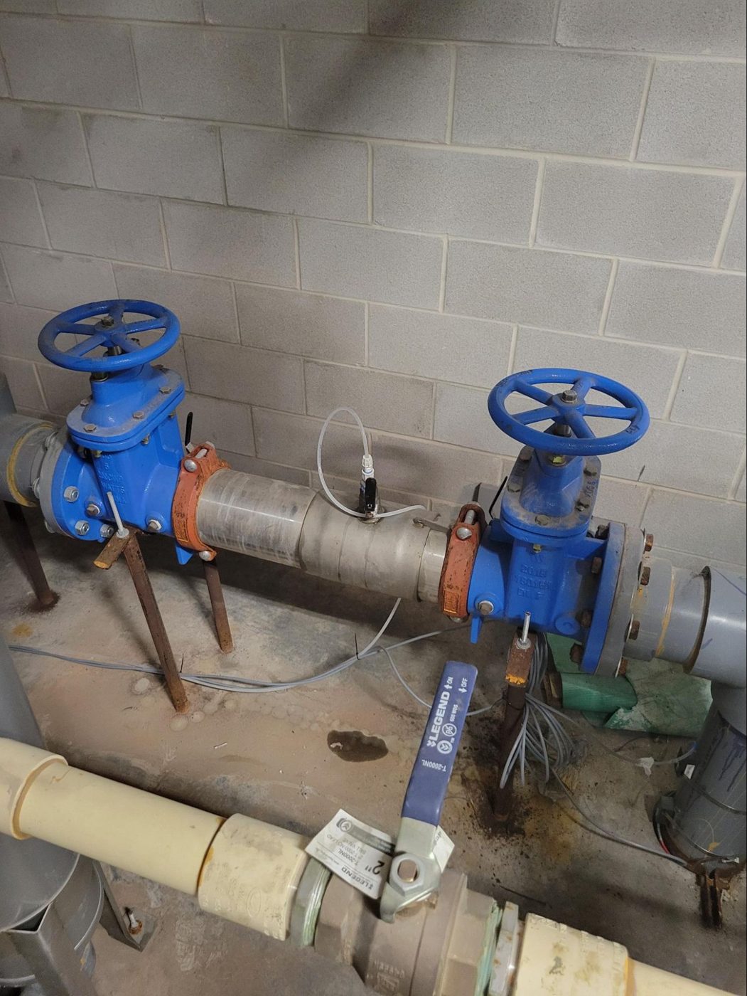 8-inch water main injection point in a downtown Austin high-rise mechanical room
